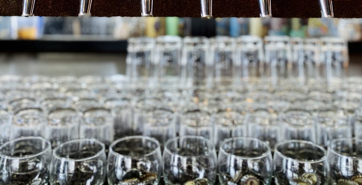 Glassware lined up under the taps at the MudHen taproom