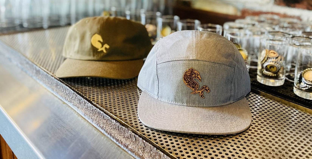 MudHen caps on the bar at the taproom