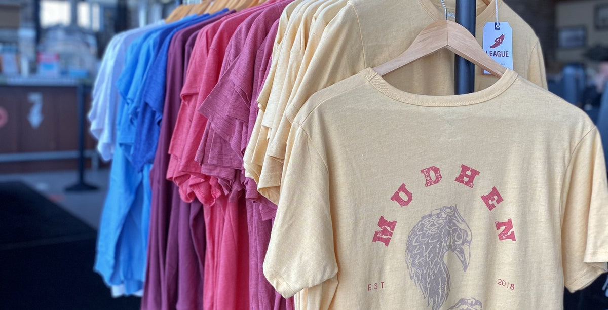 MudHen tees on the rack in the taproom shop