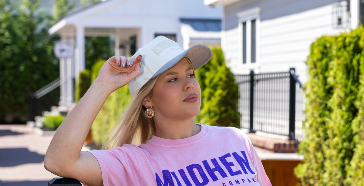 MudHen pink logo tee worn outside the brewery in Wildwood