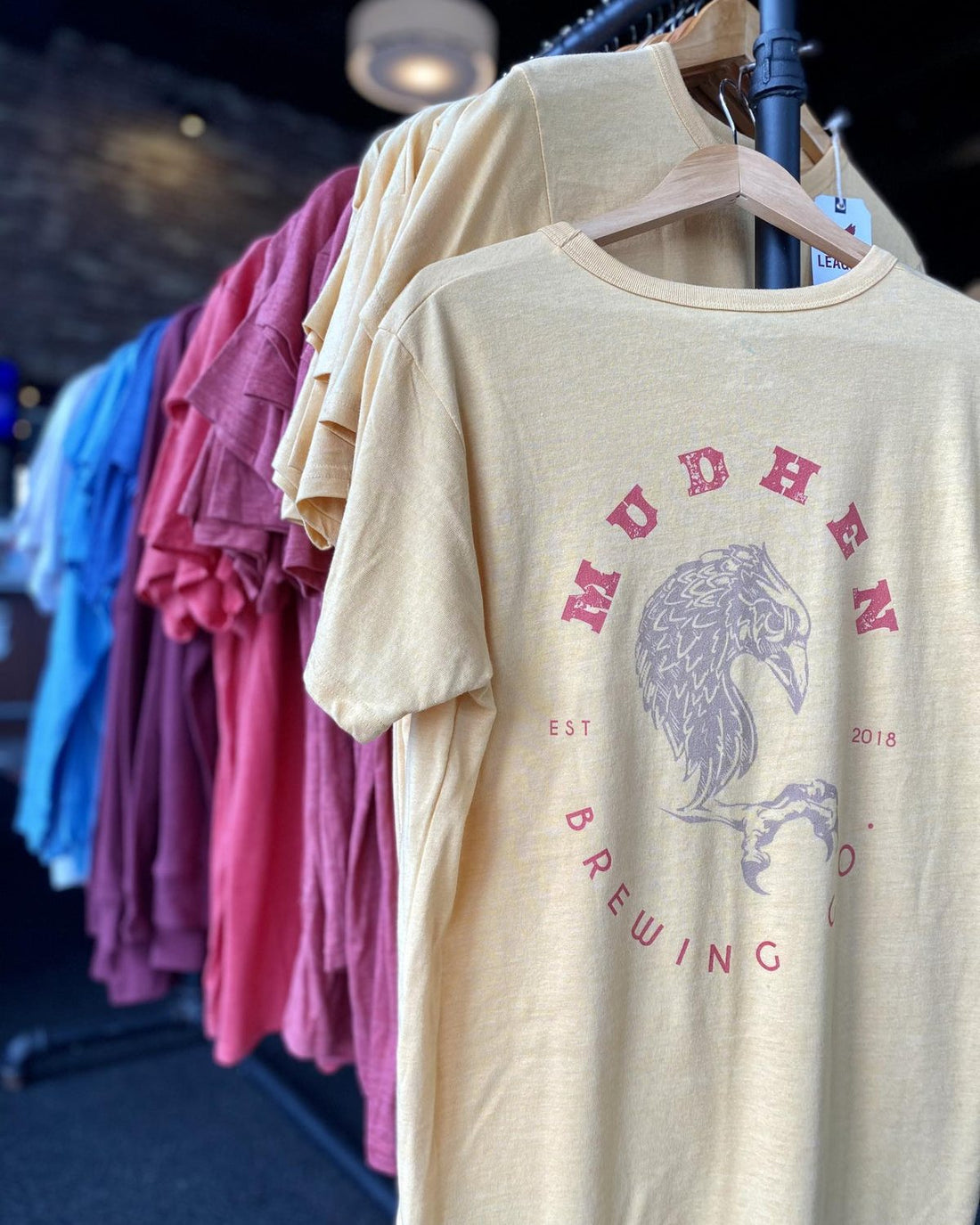 MudHen tees on the rack in the taproom shop