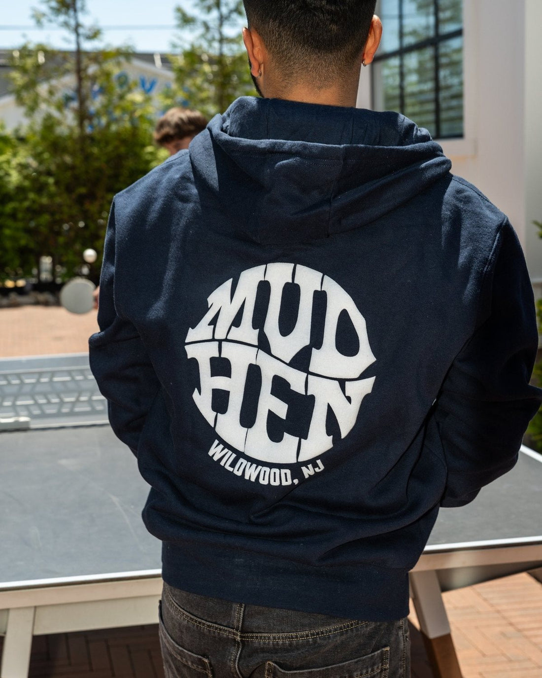 Navy MudHen Wildwood NJ hoodie worn at the brewery